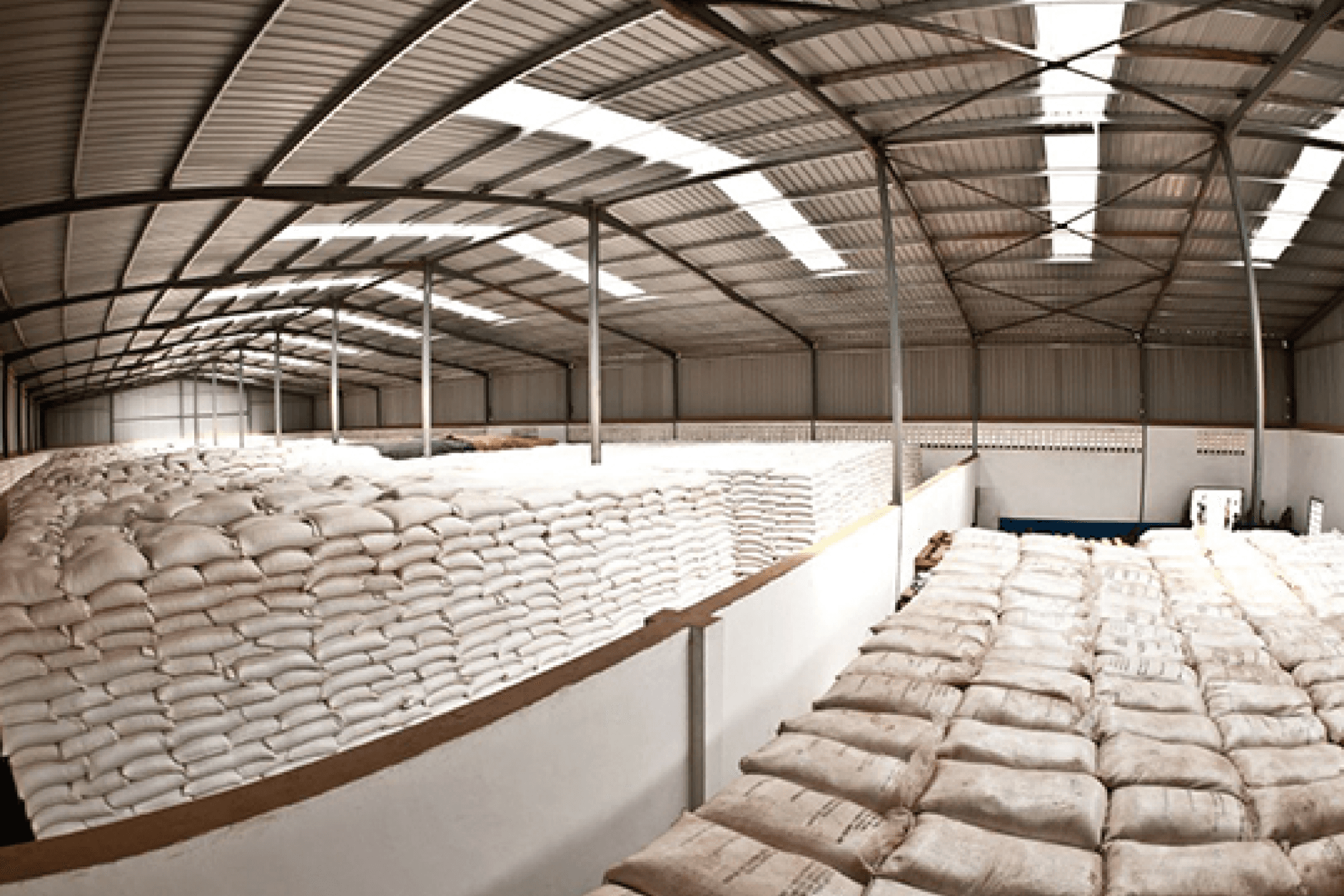 Interior of a YYUSSA warehouse stacked with commodity sacks