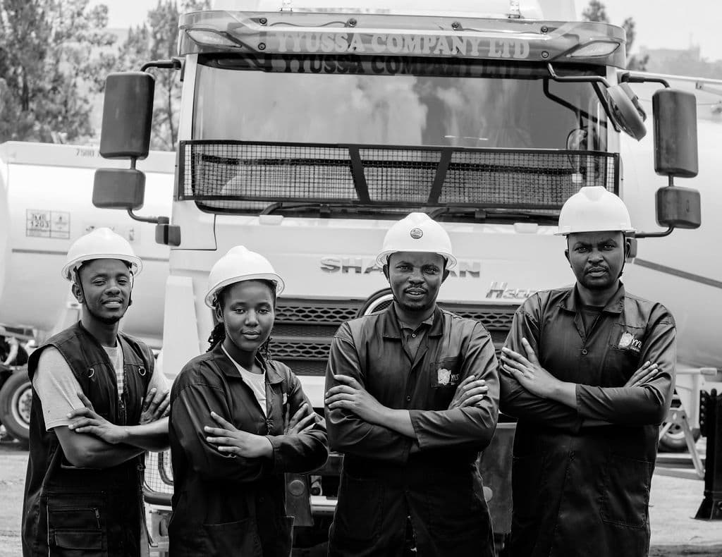 YYUSSA drivers in front of a branded tank trailer